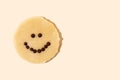 Smiley face chocolate chip cookie dough on yellow background in bright light, the joy of cooking Royalty Free Stock Photo