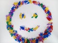 Smiley face with colorful beads on a white background