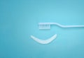 Smiley face created from paste with white Toothbrush. Means to care for the oral cavity. Concept of oral hygiene in the family Royalty Free Stock Photo