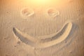 A smiley face drawing on a sand Royalty Free Stock Photo