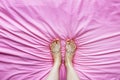 Smiley Face Emotion Barefoot. Beautiful Female Feet on Pink Fabric Bedroom Background Royalty Free Stock Photo