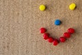 Smiley face made with pins on a cork board Royalty Free Stock Photo