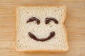 Smiley face on a piece of black bread Royalty Free Stock Photo