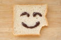 Smiley face on a piece of black bread Royalty Free Stock Photo