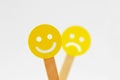 Smiley face with positive expression in front of out of foucs sa Royalty Free Stock Photo
