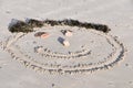 Smiley face in sand