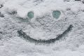 Smiley face on snow surface. Winter concept. Royalty Free Stock Photo