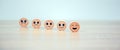 Smile face on wooden toy for customer services rating feedback satisfaction survey business review questionnaire development for Royalty Free Stock Photo