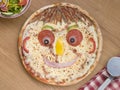 Smiley Faced Pizza with a Side Salad Royalty Free Stock Photo