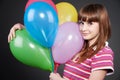 Smiley girl with motley balloons