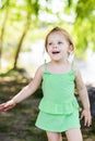 Smiley little girl having fun with bubble blower