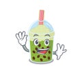 Smiley matcha bubble tea cartoon mascot design with waving hand Royalty Free Stock Photo