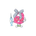Smiley Nurse love gift pink cartoon character with a syringe Royalty Free Stock Photo
