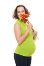 Smiley pregnant woman with flowers Royalty Free Stock Photo