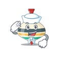 Smiley sailor cartoon character of top toy wearing white hat and tie