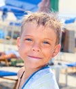 Smiley seven years old boy on the beach