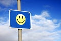 Smiley sign against a blue sky Royalty Free Stock Photo