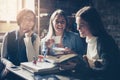 Smiley students girls talking in cafe.