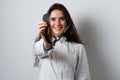 Smiley woman doctor surgeon with stethoscope on white background. Professional medecine. advert for medical clinic. Royalty Free Stock Photo