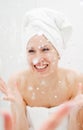 Smiley woman washing herself