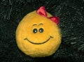 Smiley stuffed toy on the Christmas tree