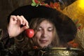 Smiliing witch with apple Royalty Free Stock Photo