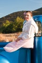 Smiling 1950s teen girl in pickup truck Royalty Free Stock Photo