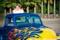 Smiling 1950s teen girl in pickup truck Royalty Free Stock Photo