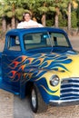 Smiling 1950s teen girl in pickup truck Royalty Free Stock Photo