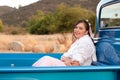 Smiling 1950s teen girl in pickup truck Royalty Free Stock Photo