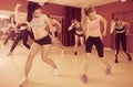 Smiling active women exercising dance moves