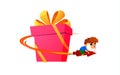 Smiling adorable cartoon boy riding rocket around holdiay giftbox