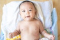 Smiling adorable infant 3 month baby lying on blanket