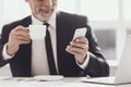 Smiling Adult Businessman on Coffee Break at Work Royalty Free Stock Photo