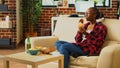 Smiling adult eating hamburger with fries and alcohol Royalty Free Stock Photo