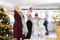 Smiling adult lady in elegant clothes dancing in couple latin dance, energetic and fast jive in dance salon during