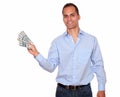 Smiling adult man holding cash dollars