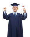 Smiling adult student in mortarboard with diploma