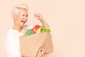 Woman holding shopping bag with healthy food Royalty Free Stock Photo