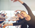 Smiling adult women stretching in ballet class Royalty Free Stock Photo