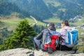 Smiling adventure couple with map on slope. look at map