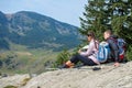 Smiling adventure couple with map on slope. look at map