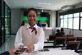 Smiling african america airport worker giving documents to tourist,checking passport airport Royalty Free Stock Photo