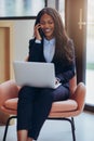 Smiling African America businesswoman working and talking on her Royalty Free Stock Photo