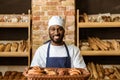 smiling african american baker holding basket