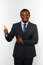 Smiling african american black man in business suit with thumbs up like gesture isolated on white Royalty Free Stock Photo