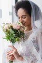 smiling african american bride enjoying smell Royalty Free Stock Photo