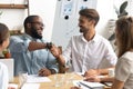 Smiling African American businessman shaking hand of business partner Royalty Free Stock Photo