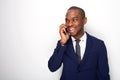 Smiling african american businessman on white background talking with cellphone Royalty Free Stock Photo