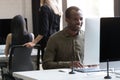 Smiling african american businessman working on his computer Royalty Free Stock Photo